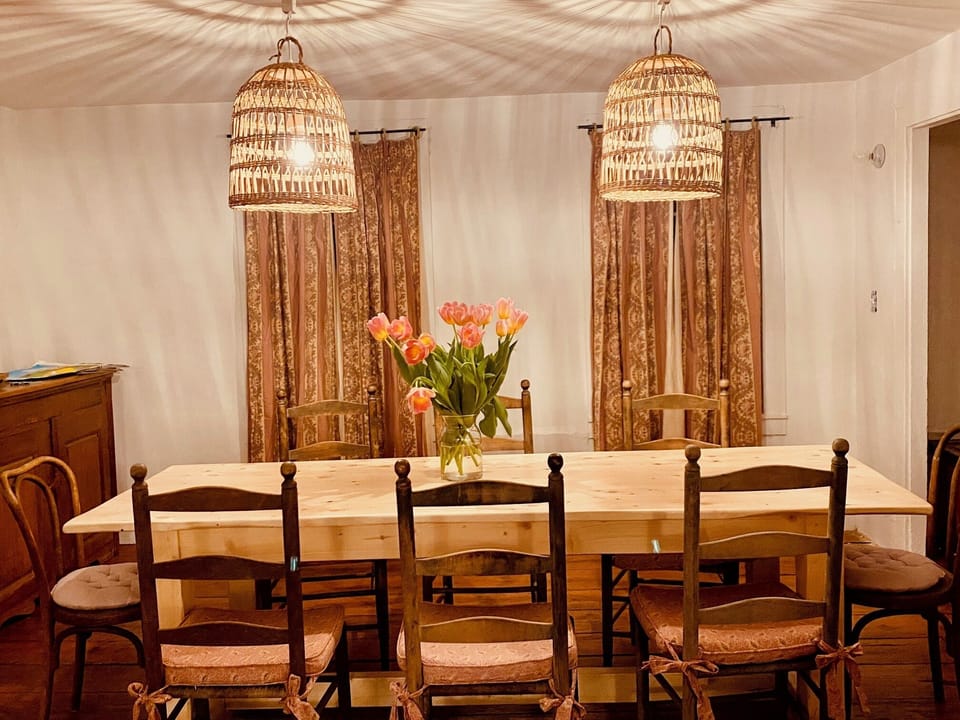 Enjoy home-cooked meals in this cozy dining space just steps from the fully equipped kitchen