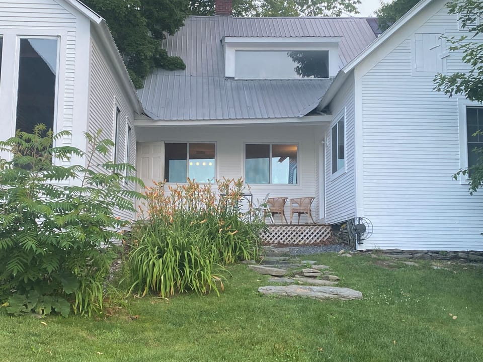 Step out from the kitchen onto a peaceful back porch - perfect for morning coffee or evening unwinding, with views of the spacious backyard