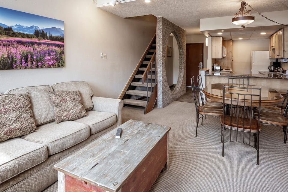 Bright living area with cozy seating and open loft-style layout.