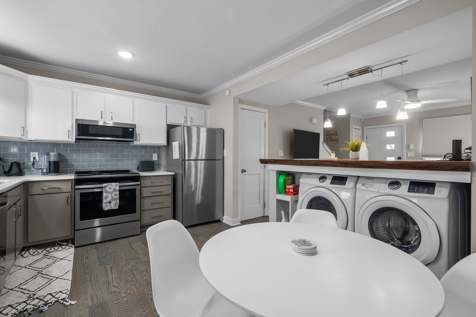 The dining/kitchen combo separate from living room but open to it.