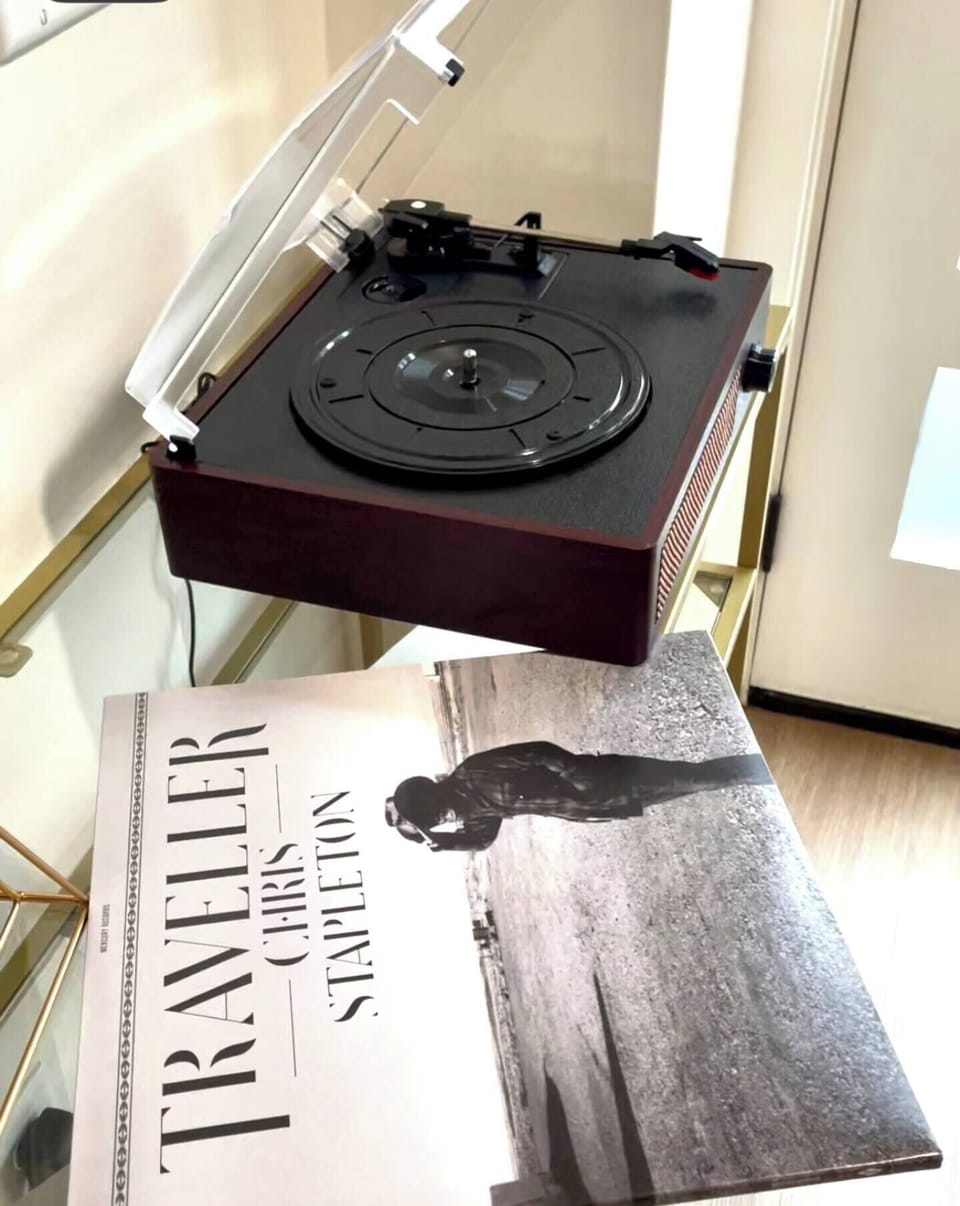 Enjoy the warm, rich sound of our record player, complete with a curated selection of vinyl records. Whether you're spinning classics or discovering new favorites, this nostalgic addition brings a timeless charm to your stay.