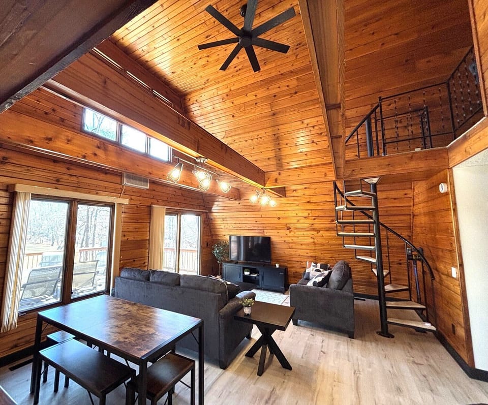 Open concept living area w/ steps up to loft. Picnic-style dining table for 6