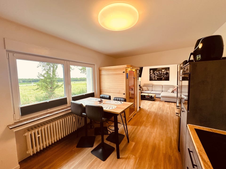 Bedroom 2 with 180 x 200 cm wall bed, dining area and sauna