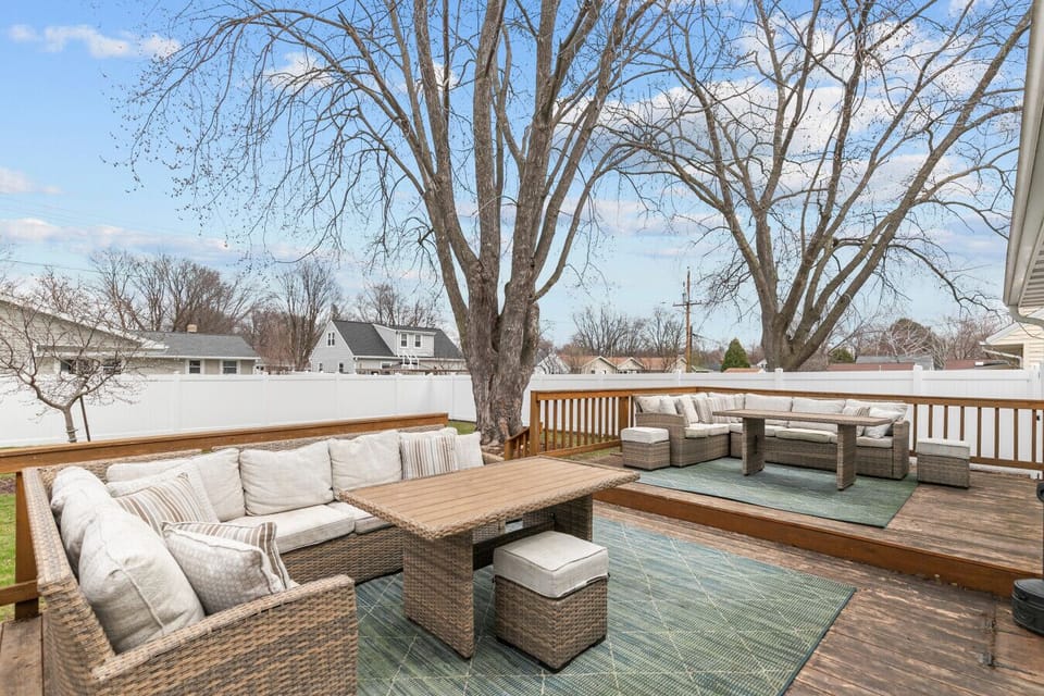 Sunny and spacious back deck ready for grilling, dining, and fun.