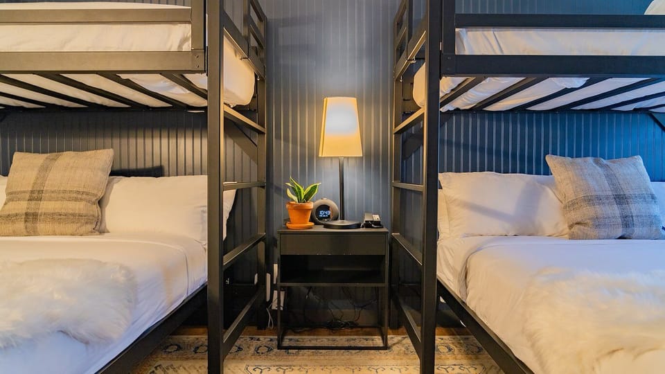 Enjoy warm bedside lighting and easy access to both bunks.