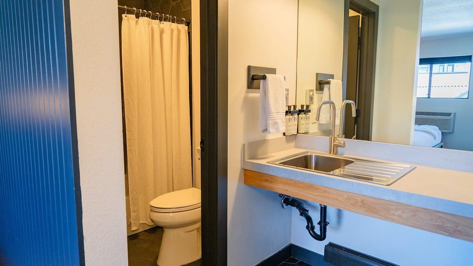 Freshen up with bright vanity space and hotel-style amenities.
