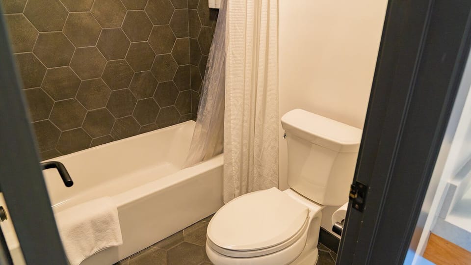Rinse off in a clean tub-shower after a full day.