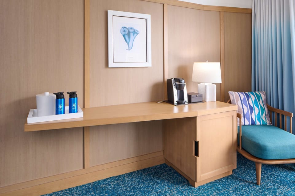 Sip fresh coffee and settle into a stylish in-room workspace.