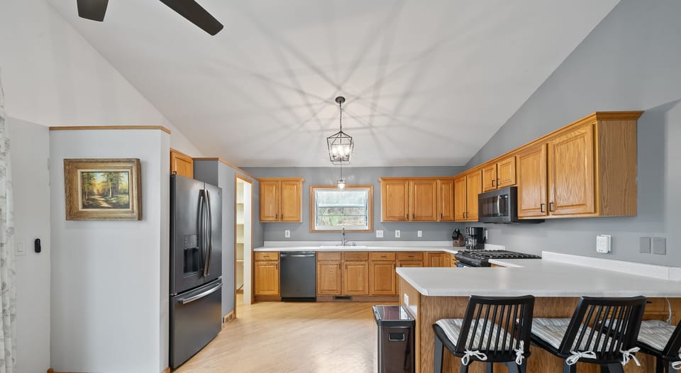 Large kitchen with breakfast bar seating for 3
