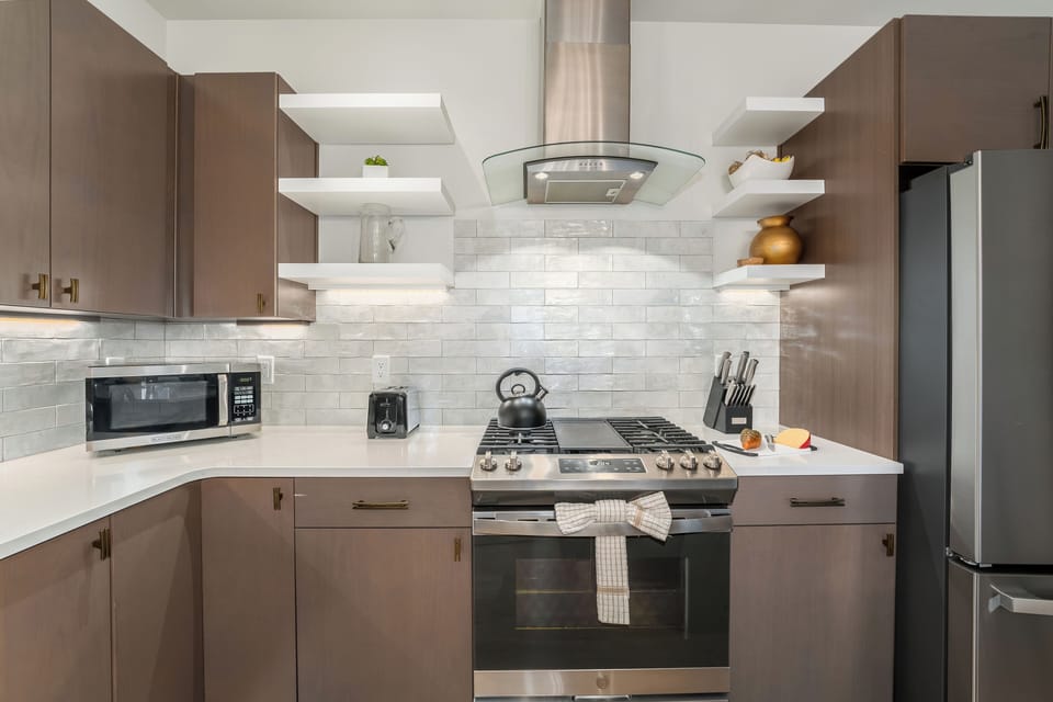 Modern Kitchen with Stainless Steel Appliances & Stone Countertops | Main Level