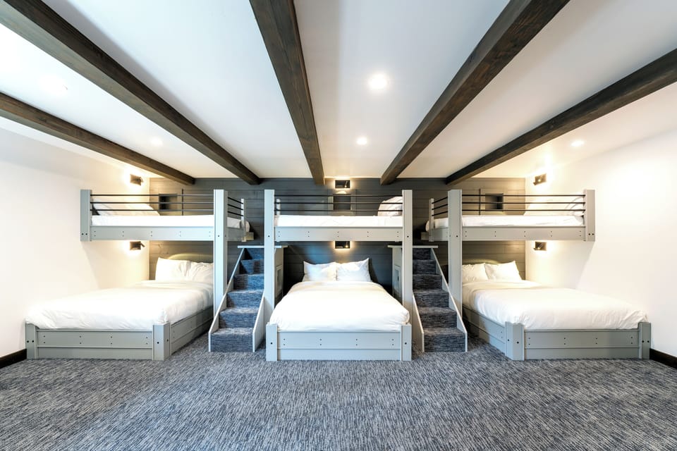 Bedroom 2 (Middle Level)- Three Full Over Queen Bunk Beds, Desk Area, Sofa Seating and 2 En Suite Bathrooms! | Middle Level
