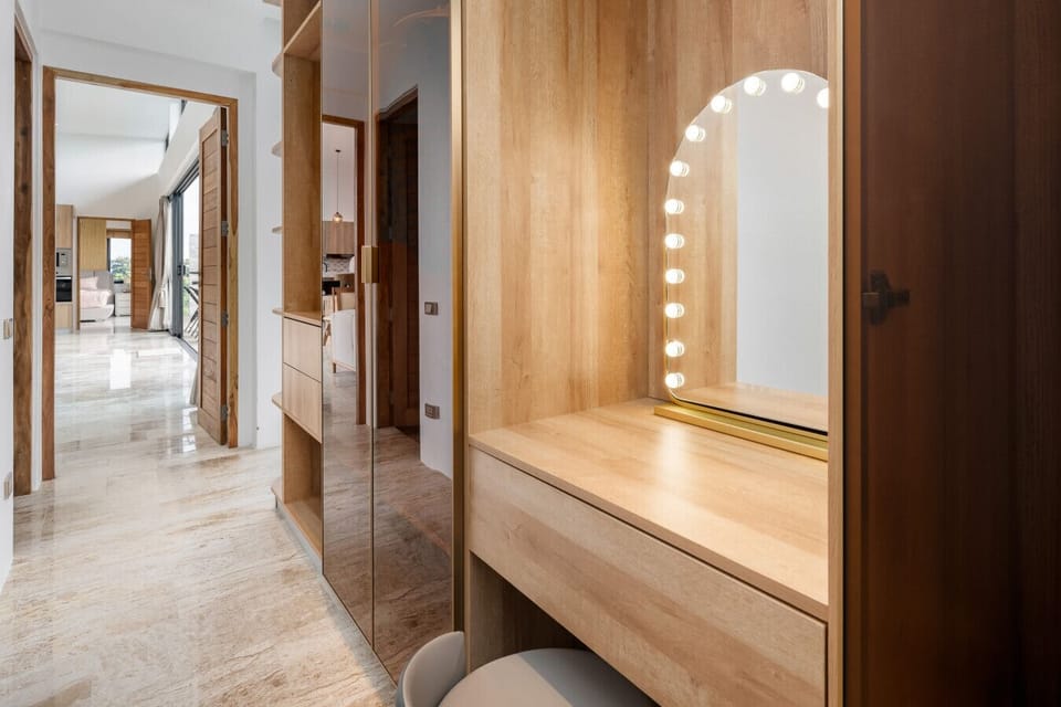 Elegant hallway with built-in wooden vanity and soft lighting — stylish details that reflect Villa Gala’s refined design.