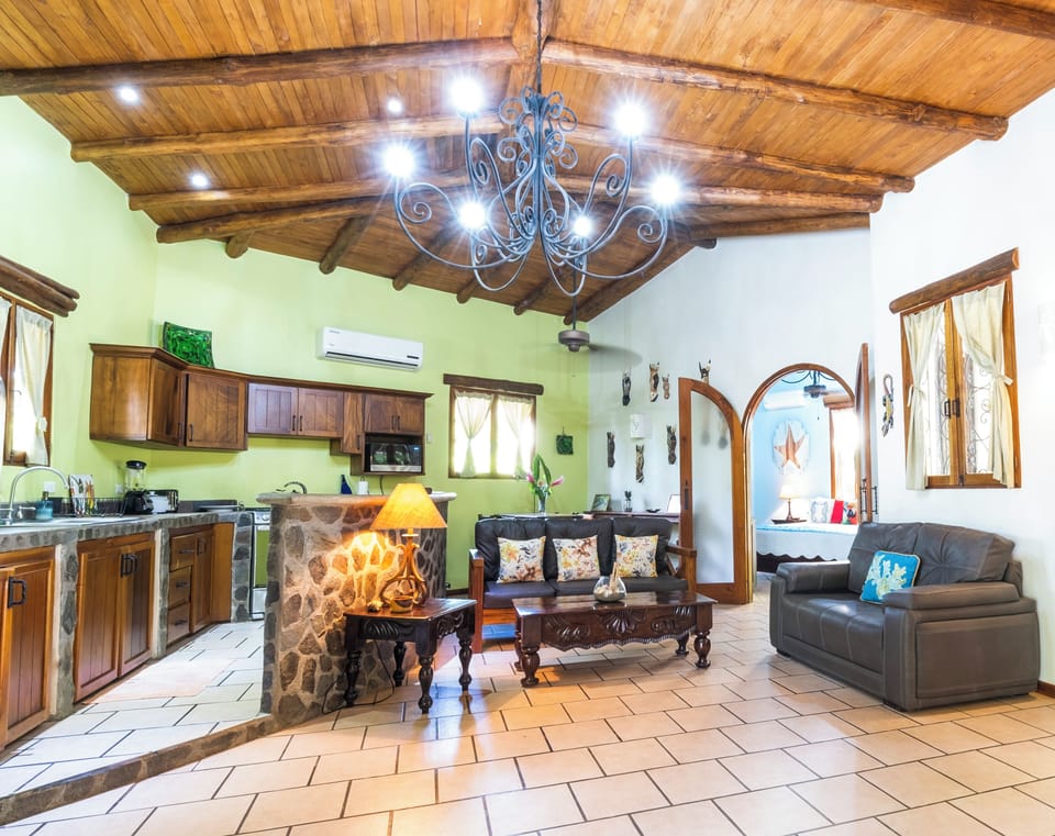 Charming and comfortable living space with seamless flow to the full kitchen.
