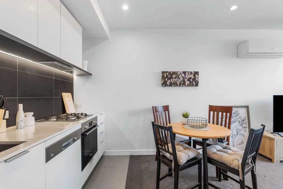 Open kitchen with dining table that seats 4 