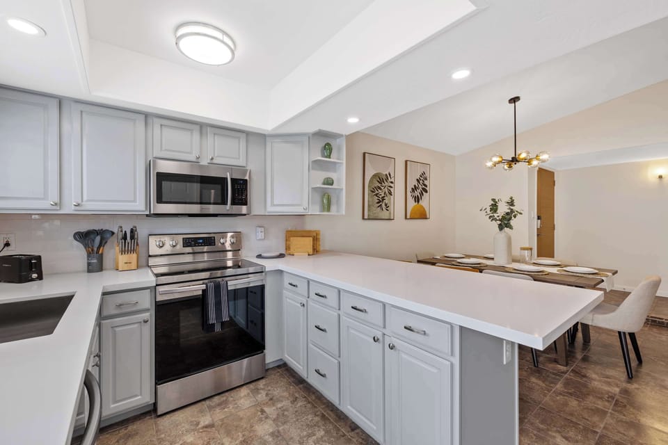 Enjoy the ease of entertaining with the kitchen and dining area flowing seamlessly together — perfect for serving up meals and making memories all in one cozy space.