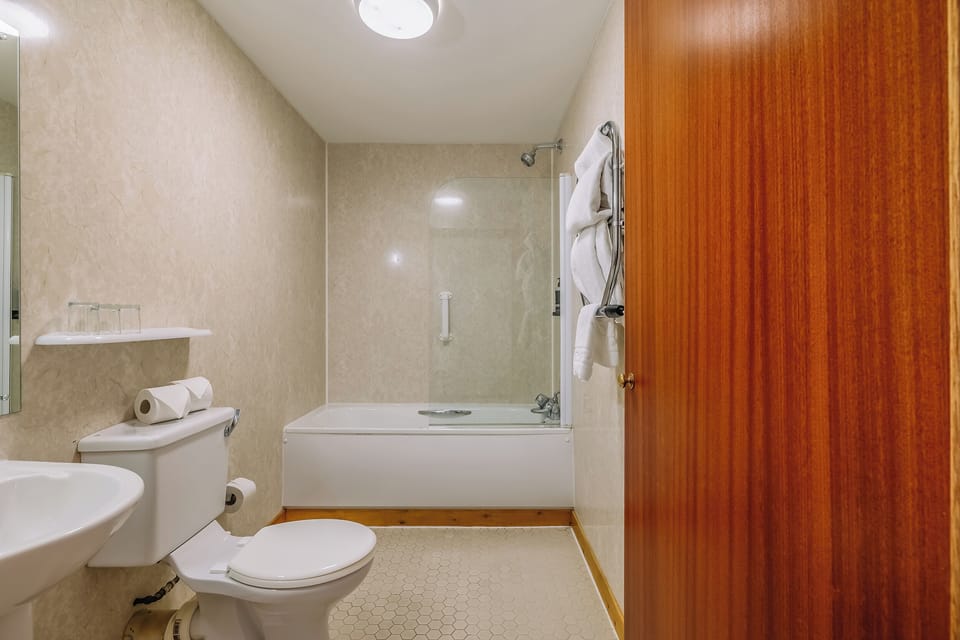 Refresh after a long day in a clean, bright bath.