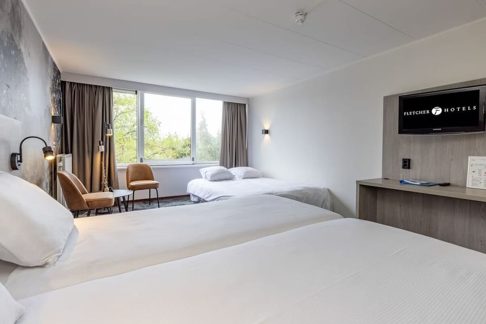 Unit with 3 single beds. Exact unit will be assigned upon arrival. Views, colors, and decor may vary.