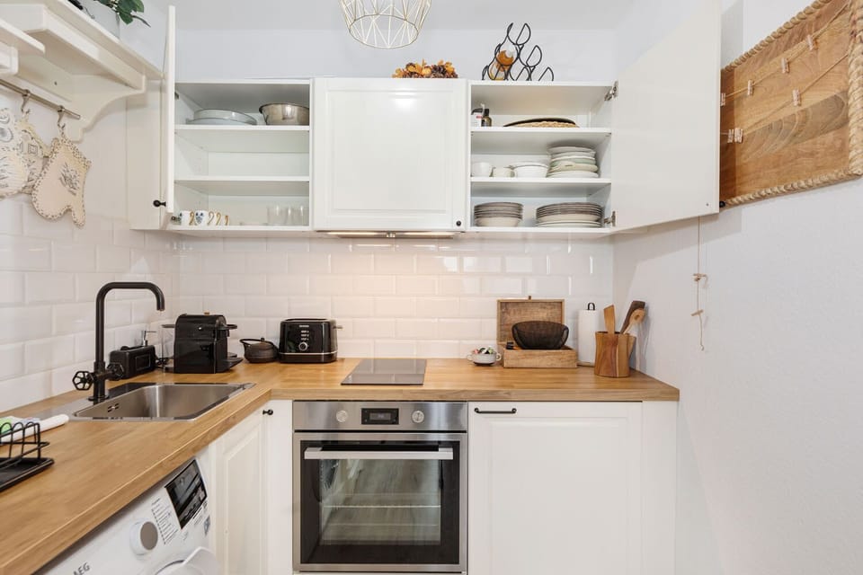 A kitchen designed for convenience: fully equipped, beautifully lit, and ready for your culinary creations.