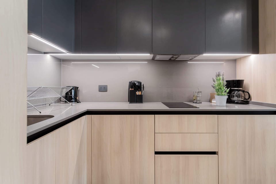 Experience culinary bliss in this modern kitchen, featuring sleek design and top-notch appliances for your cooking adventures!