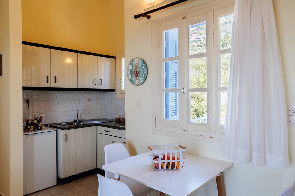 Cozy dining and living space, filled with natural light.