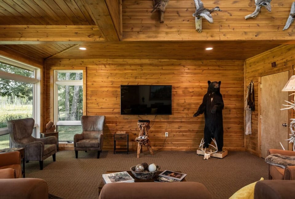 Spacious living room with comfy seating and TV.