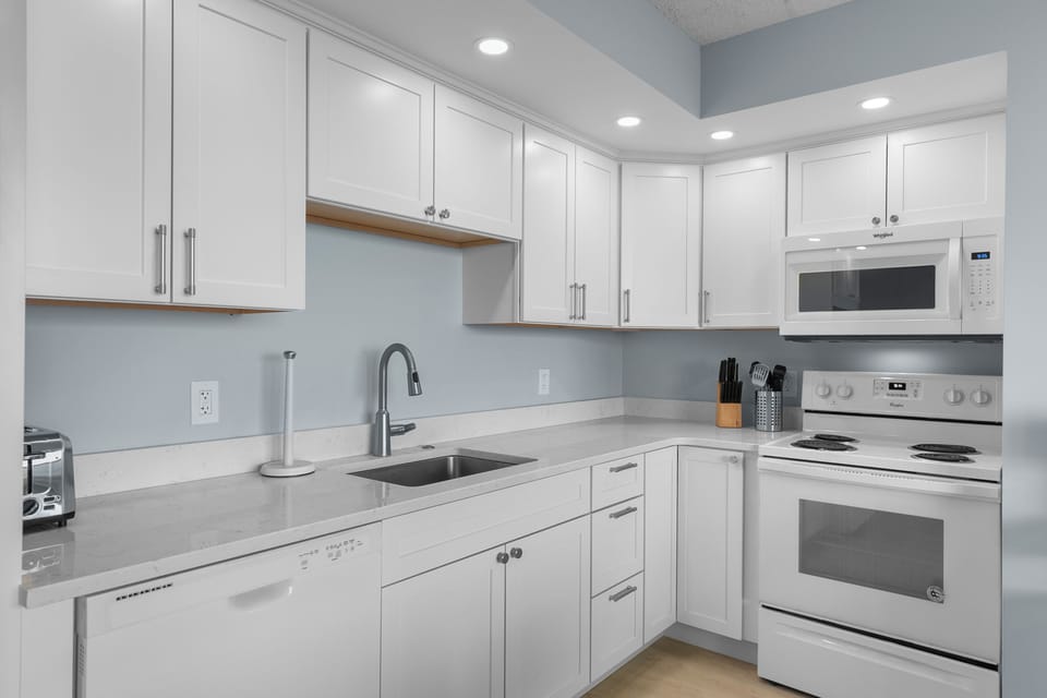 The Open Kitchen & Living Areas allow the Chef in your Family to never miss out on a bit of Family Fun.