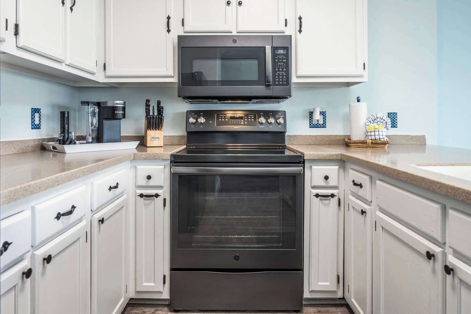 The open, airy kitchen offers ample space & every home comfort