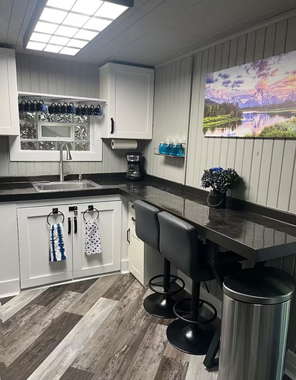 Start your mornings at the breakfast bar with coffee in hand and end your evenings cooking up favorite meals in this bright, inviting kitchen.