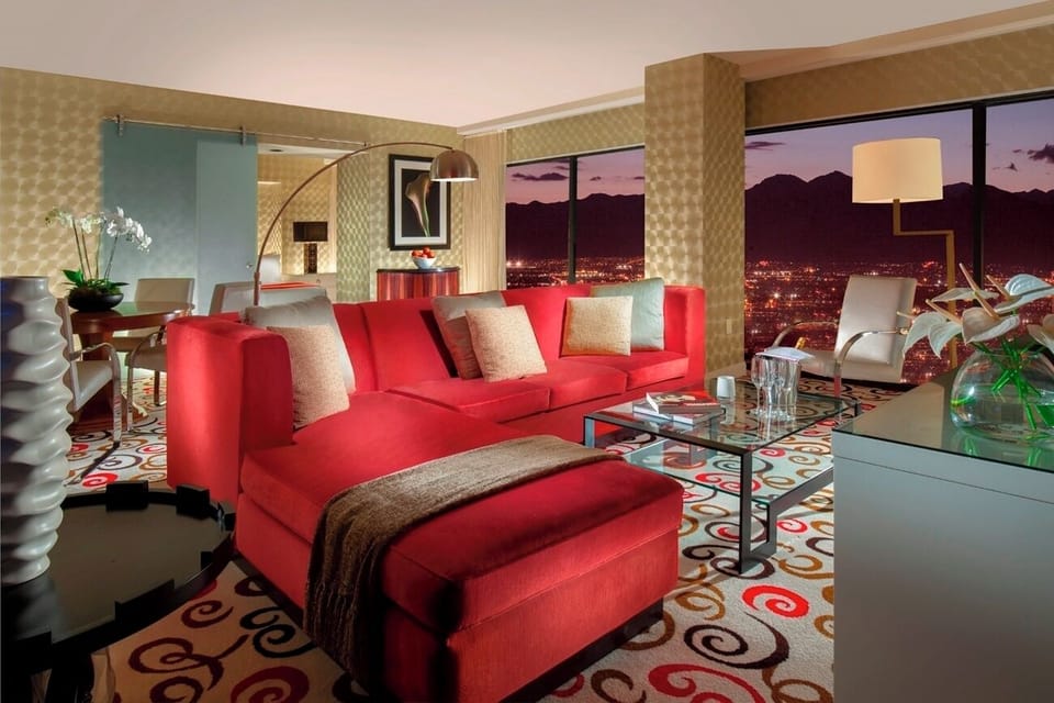 Sip a nightcap beside panoramic windows and sparkling city lights.