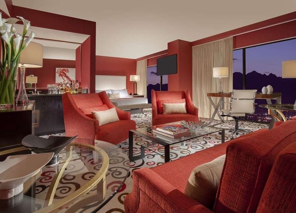 Unwind together in a spacious suite with glowing sunset views.