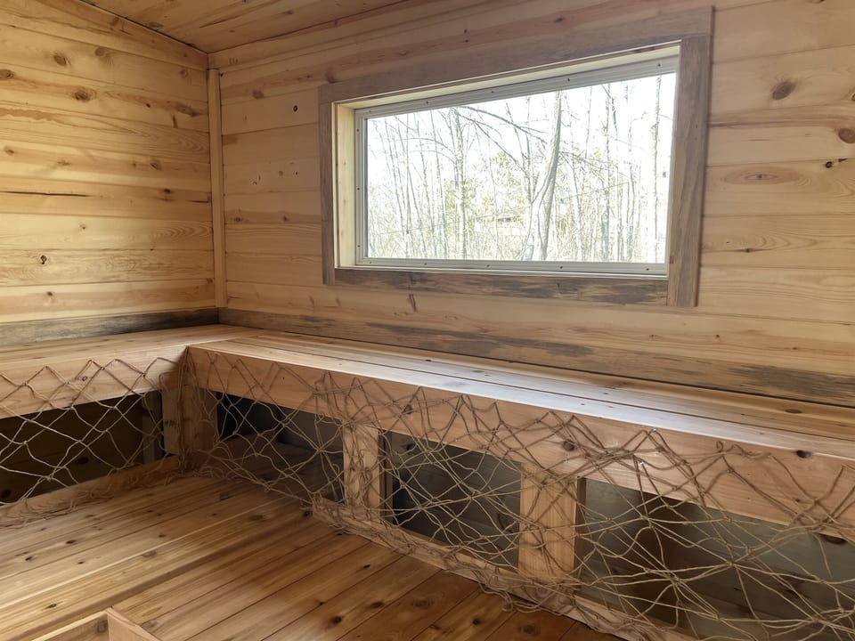 Treehouse in the Bay: Our sauna is located in the back of the Treehouse in the Bay. The sauna seats 8 comfortably, and has a view into our property