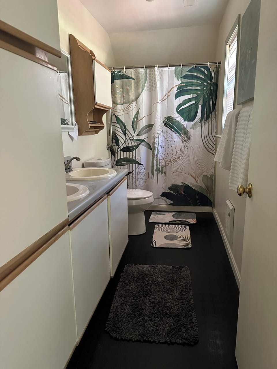 Full bath with shower and tub in bedroom wing..