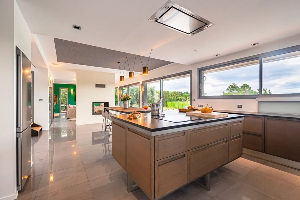 Sleek open-concept kitchen with expansive counters and premium appliances—ideal for culinary creativity and social cooking.