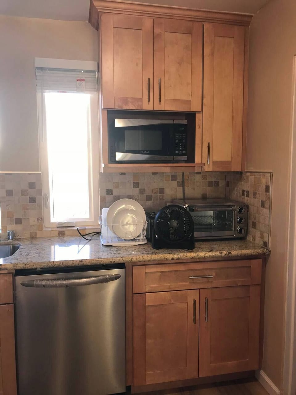 Fully equipped with dishwasher, microwave, stove, oven, etc - some on other side