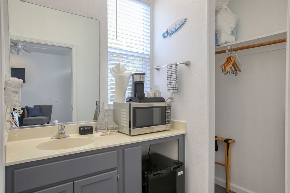 Enjoy the flexibility of a compact kitchenette, complete with a mini-fridge, microwave, and coffee maker.