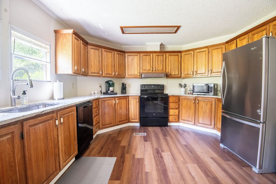 This spacious kitchen is stocked and ready for cooking, baking, or grazing all day.