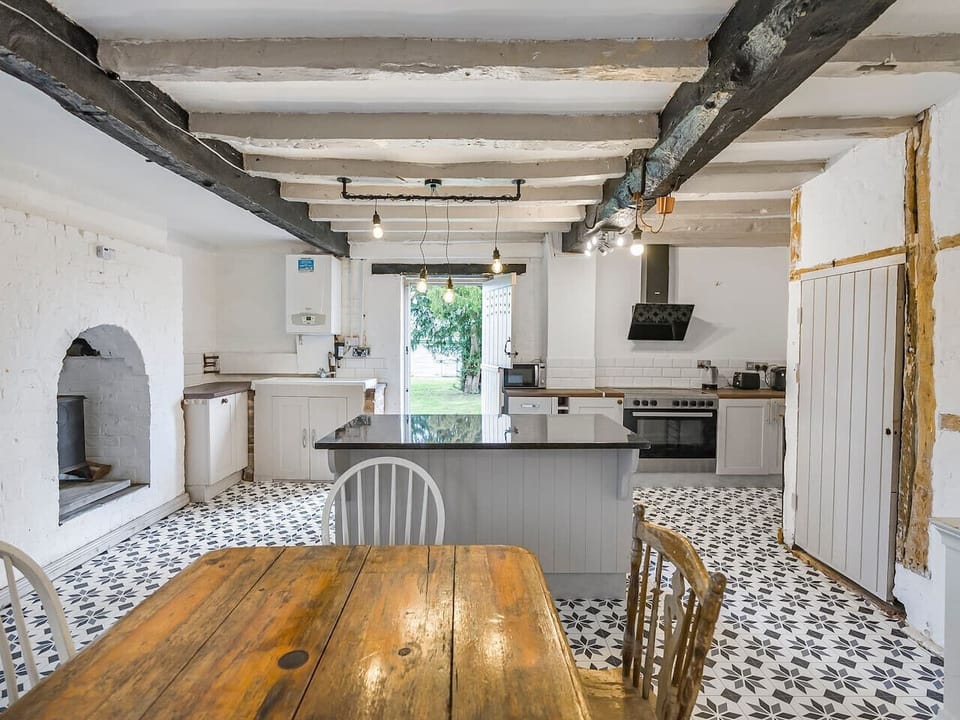 Equipped open plan kitchen with dining table