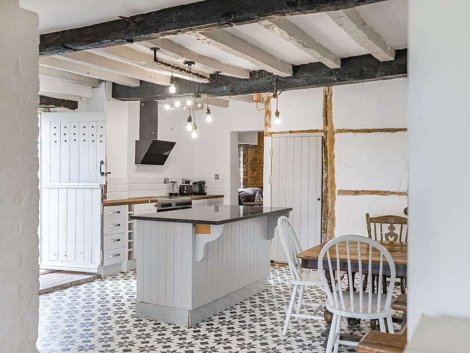 Equipped open plan kitchen with dining table
