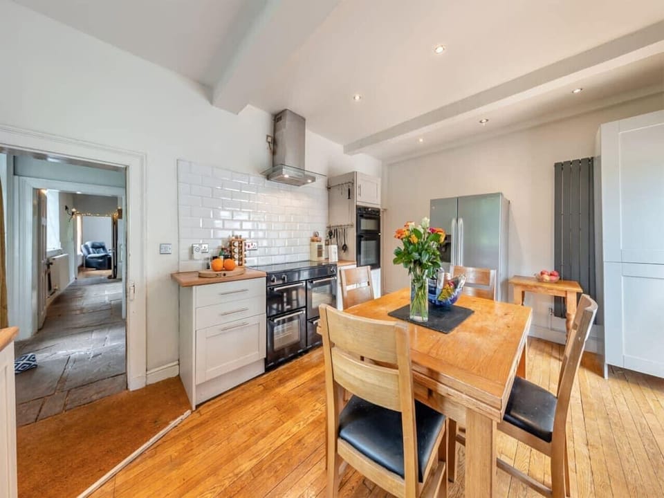 Open-plan kitchen with wood floors
