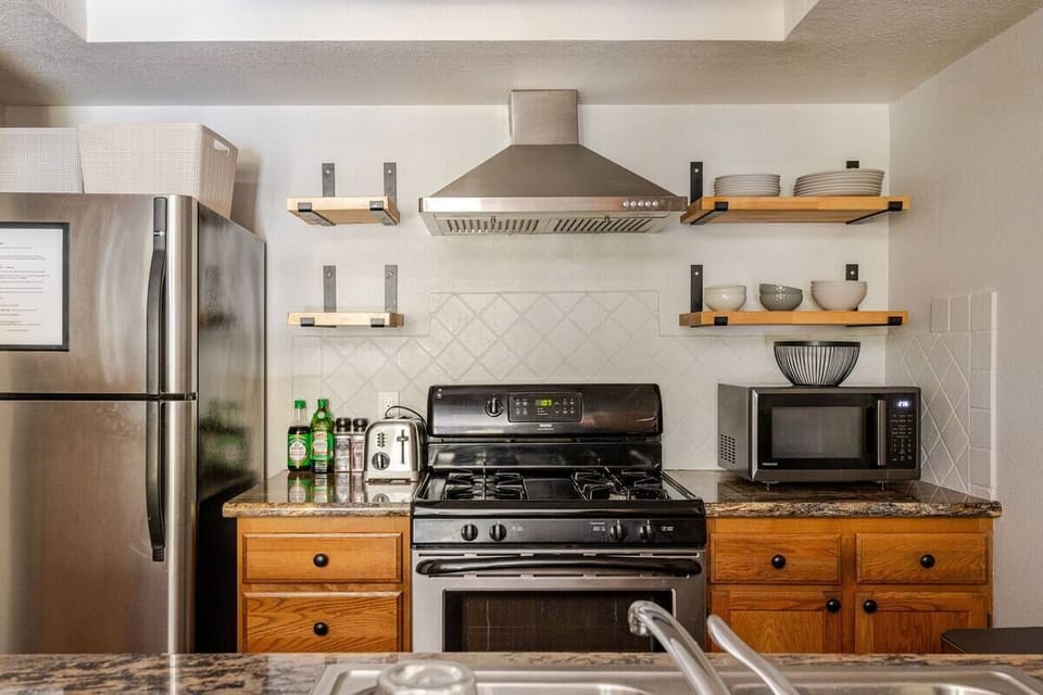 Fully equipped with stainless steel appliances, granite counters, and ample storage, this kitchen is perfect for longer stays. Guests love the easy access to essentials —ideal for anything from quick meals to full dinners.