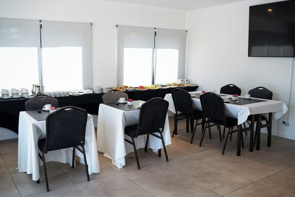 Enjoy a relaxed meal in a simple, light-filled dining space.