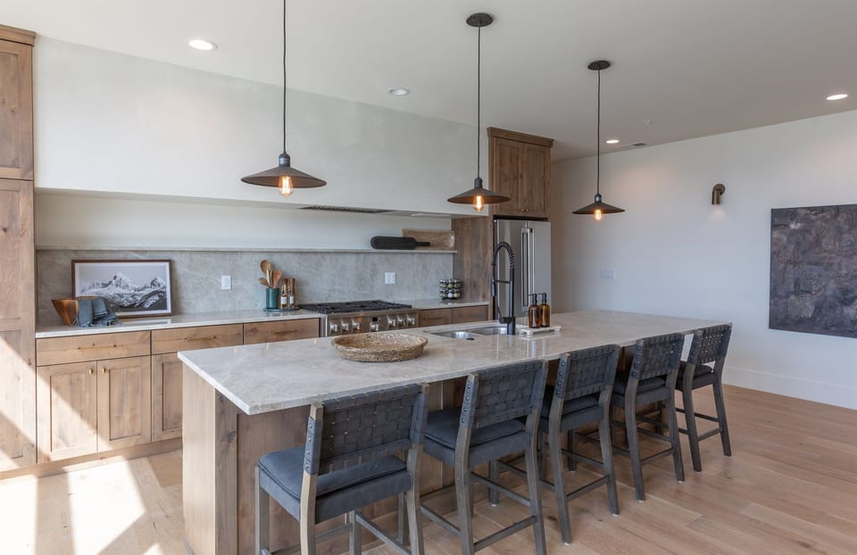 Upscale kitchen with large kitchen island with dining area