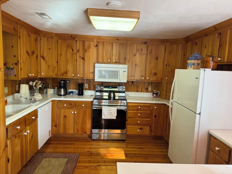 Fully stocked kitchen with new appliances, oven with air fryer. 
