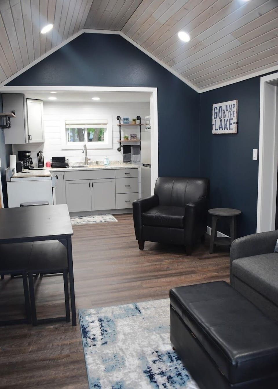 Livingroom with table and chairs that are tucked under the table as to not get in the way. 