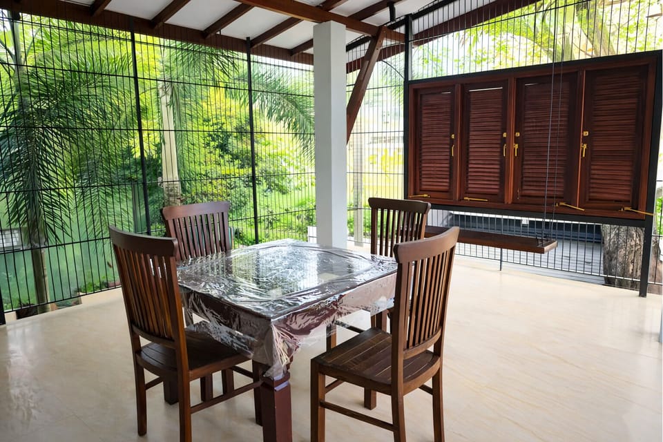 Cozy balcony swing space perfect for relaxing and enjoying the breeze