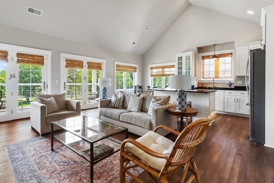 Seating area of the living room and open spaced kitchen.