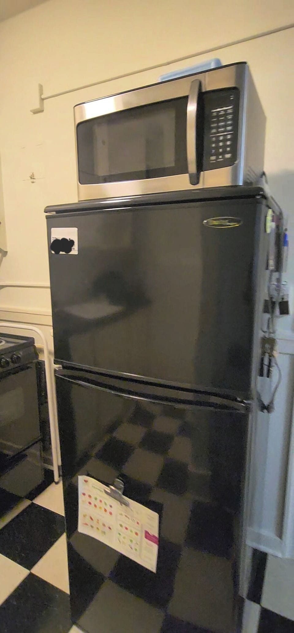 Full-sized stove, refrigerator and microwave.