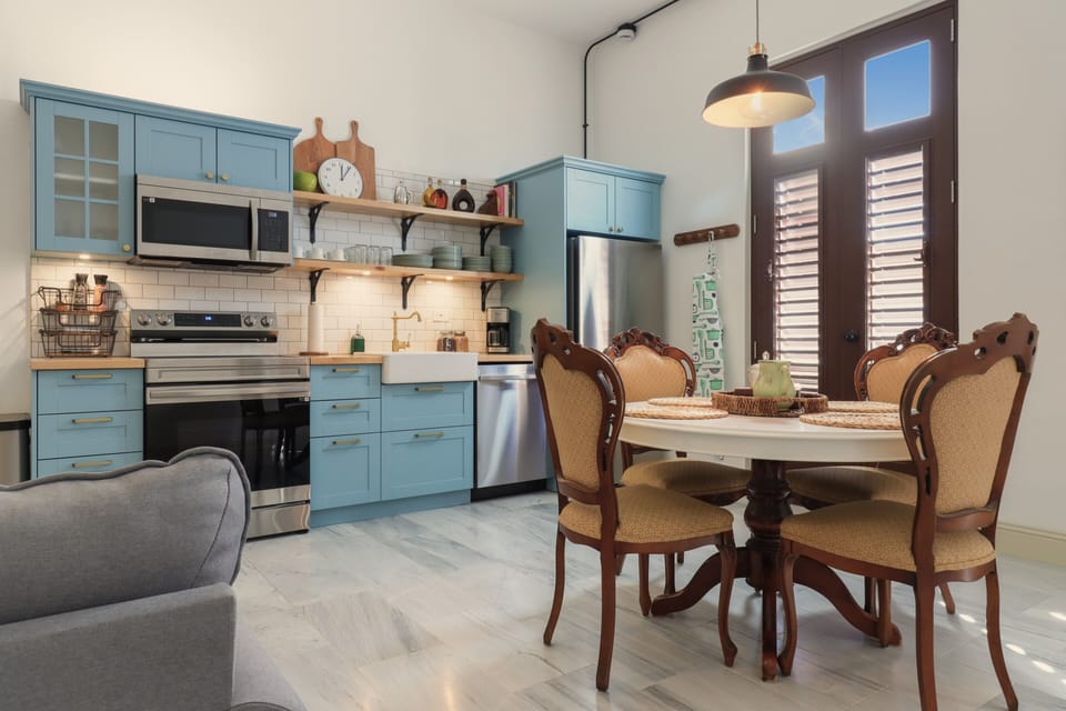 Compact but complete kitchen includes dishwasher and oven.  Dinner table for 4.