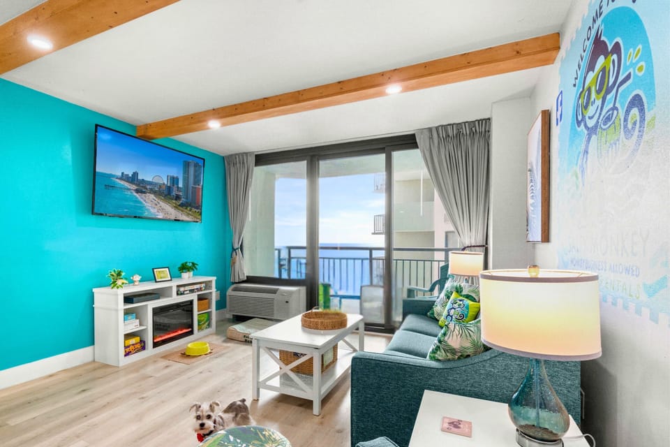 Ocean views from the sofa, with easy access to the balcony for morning coffee or a breath of fresh sea air.