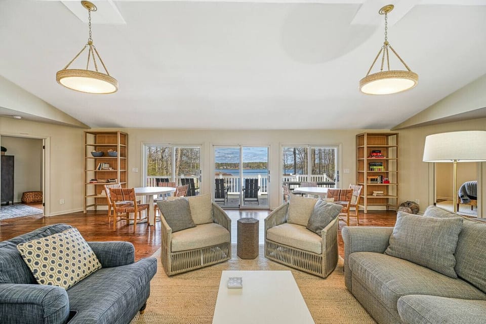 Open living area with lake views and comfortable seating for group gatherings.